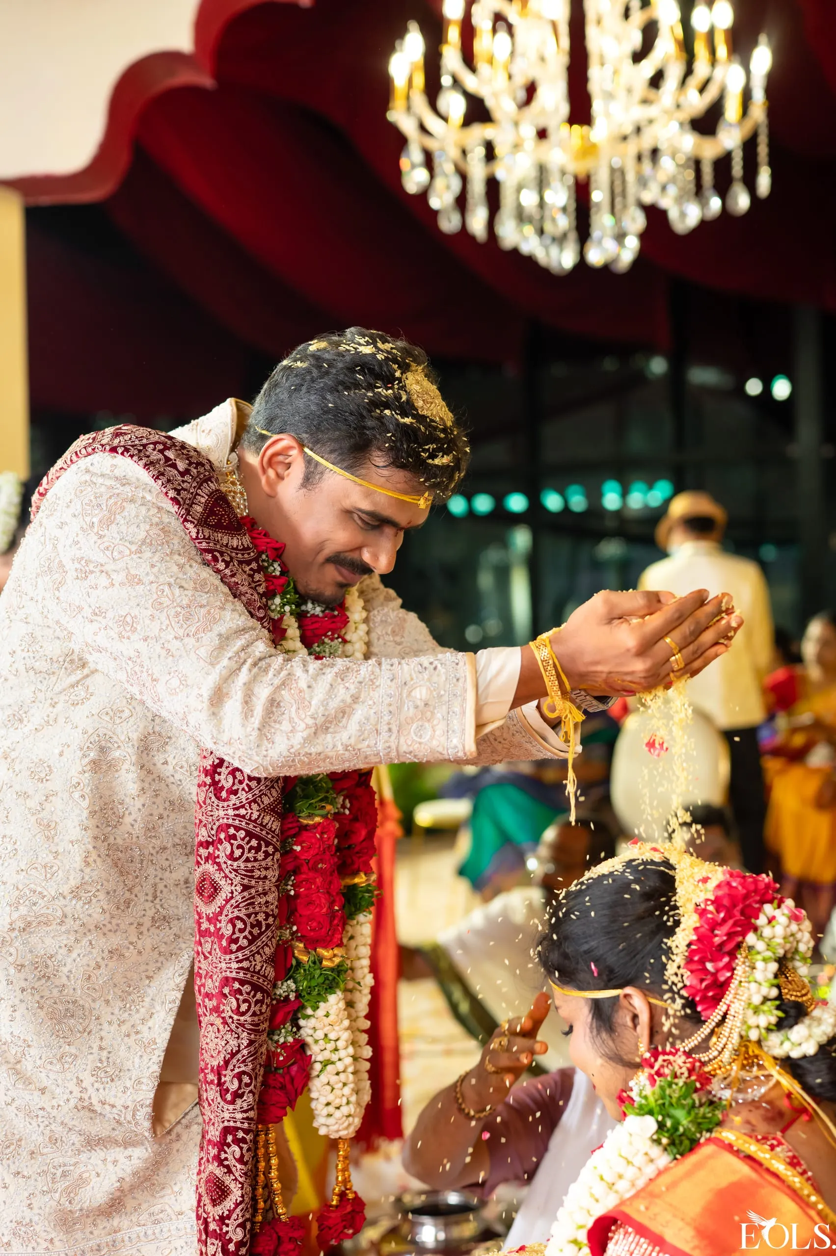 A South Indian wedding ritual, Gautham in a cream sherwani