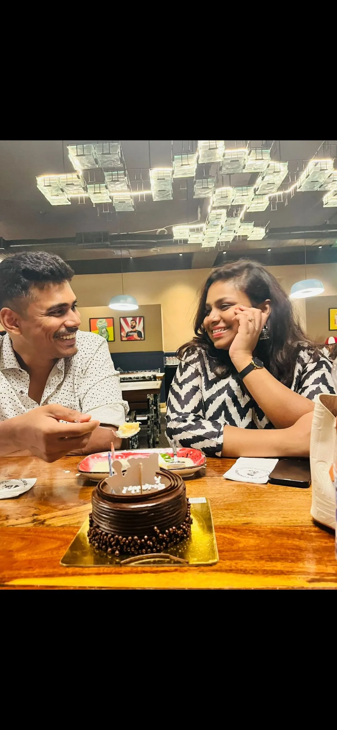 Swathi and Gautham at a restaurant over a shared meal
